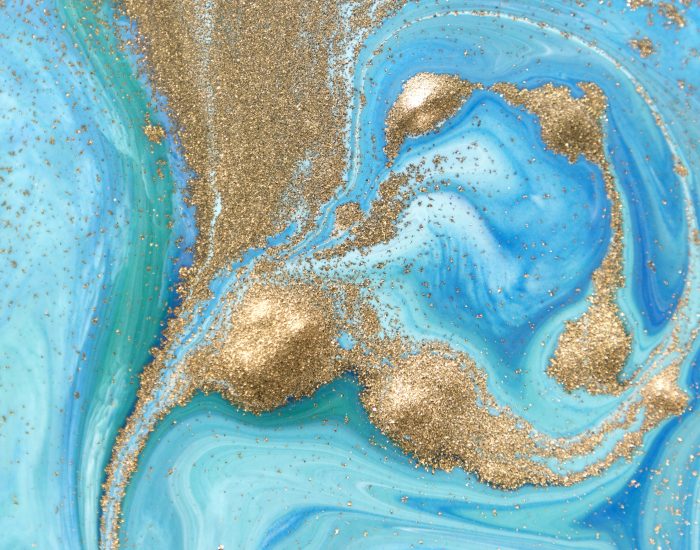Marbled green and blue abstract background with golden sequins. Liquid marble ink pattern. Marbled green and blue abstract background with golden sequins. Liquid marble ink pattern